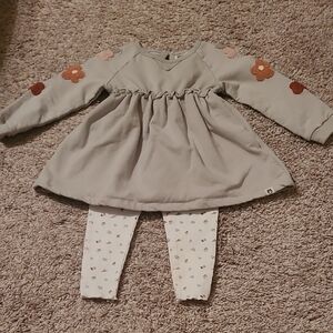 Green Dress with Floral Sleeves and White Patterned Leggings